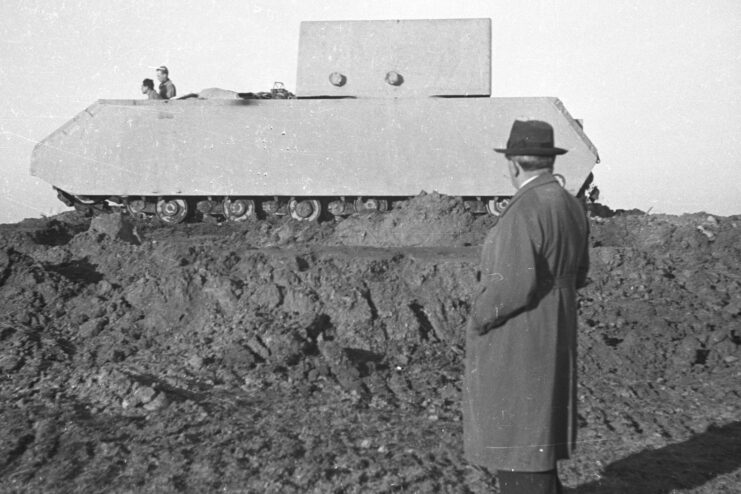 Man standing beside a Panzerkampfwagen VIII Maus