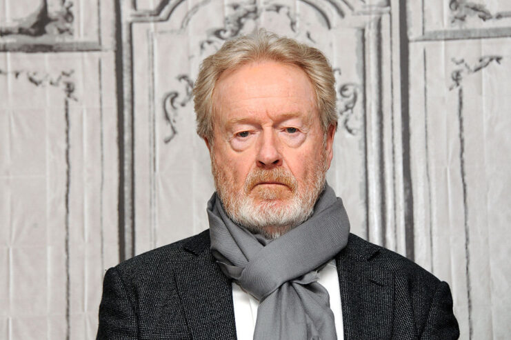 Ridley Scott posing on a red carpet