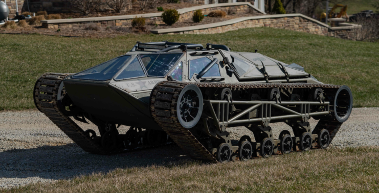 Ripsaw tracked vehicle parked along a gravel driveway
