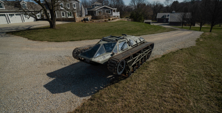 Ripsaw tracked vehicle parked along a gravel driveway