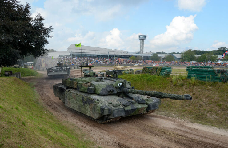 Tanks driving around a dirt track outside