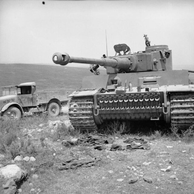 Tiger 131 parked beside a military vehicle