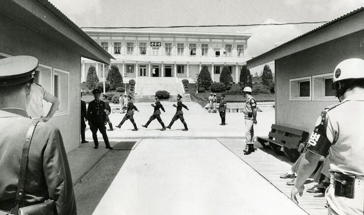 Troops marching by and standing at the Korean Demilitarized Zone (DMZ)