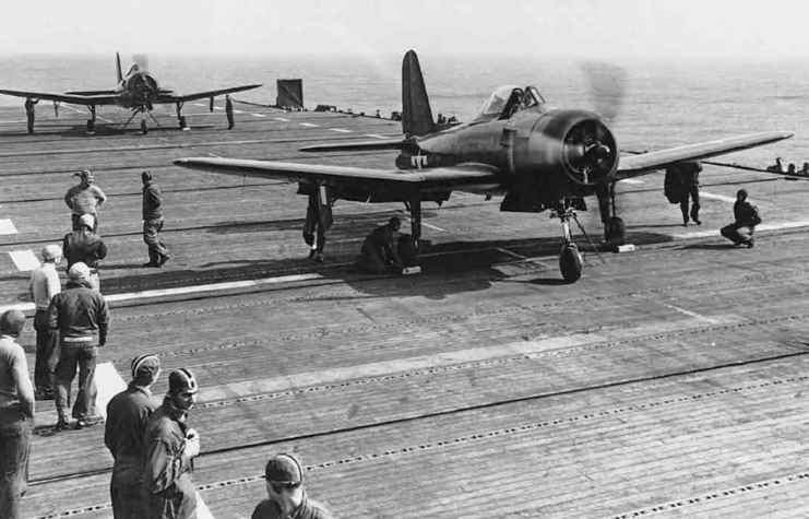 Crewmen standing around two Ryan FR-1 Fireballs on the flight deck of the USS Ranger (CV-4)