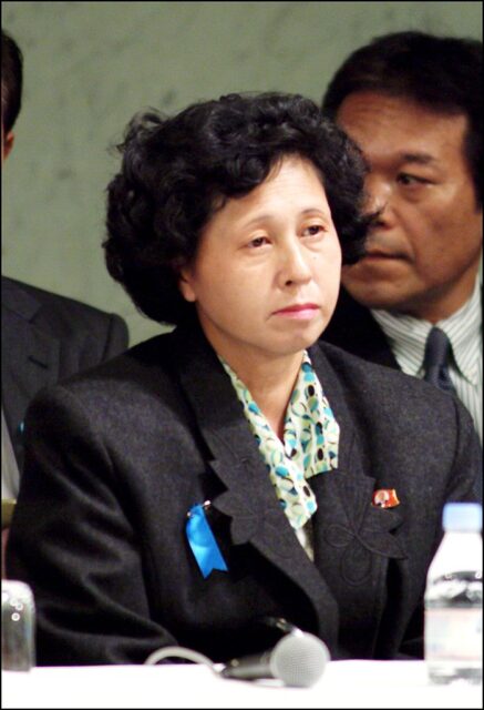 Hitomi Soga sitting at a table