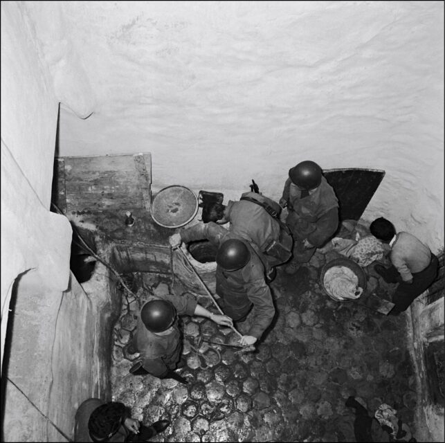 Overhead view of French paratroopers searching for weapons