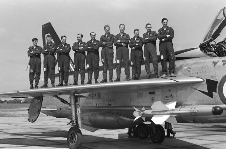 Members of the No. 111 Squadron RAF standing on the wing of an English Electric Lightning