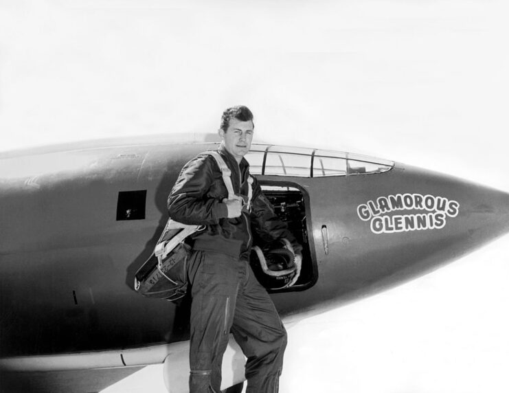 Chuck Yeager standing with the Bell X-1 'Glamorous Glennis'