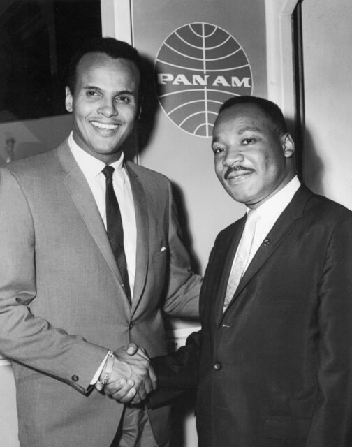 Harry Belafonte shaking hands with Martin Luther King Jr.