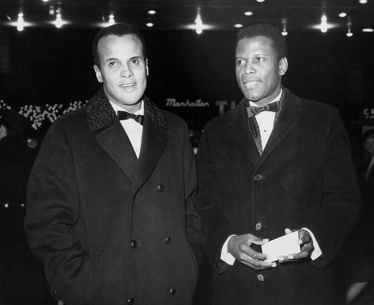 Harry Belafonte standing with Sidney Poitier