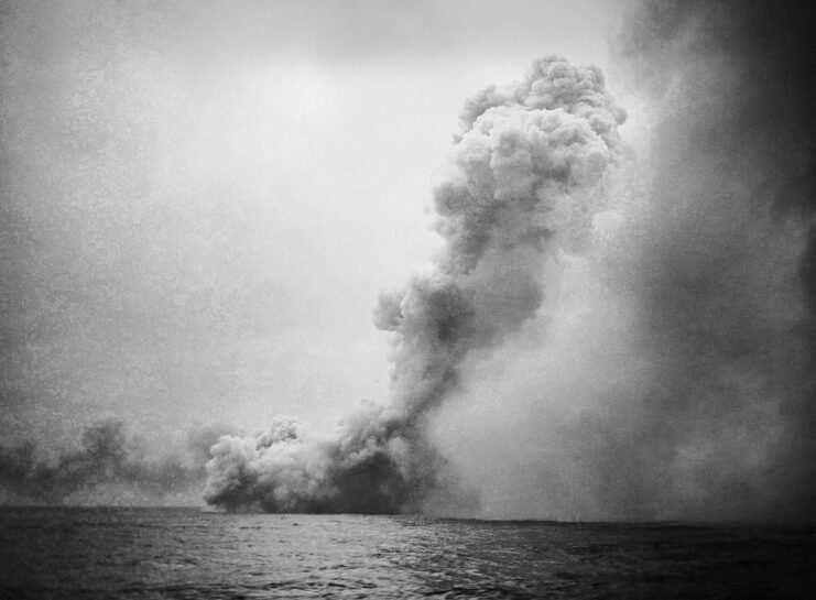 HMS Queen Mary shrouded in smoke