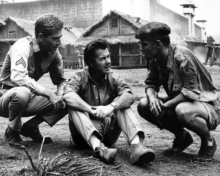 George Segal, Tom Courtenay and Bryan Forbes on the set of 'King Rat'