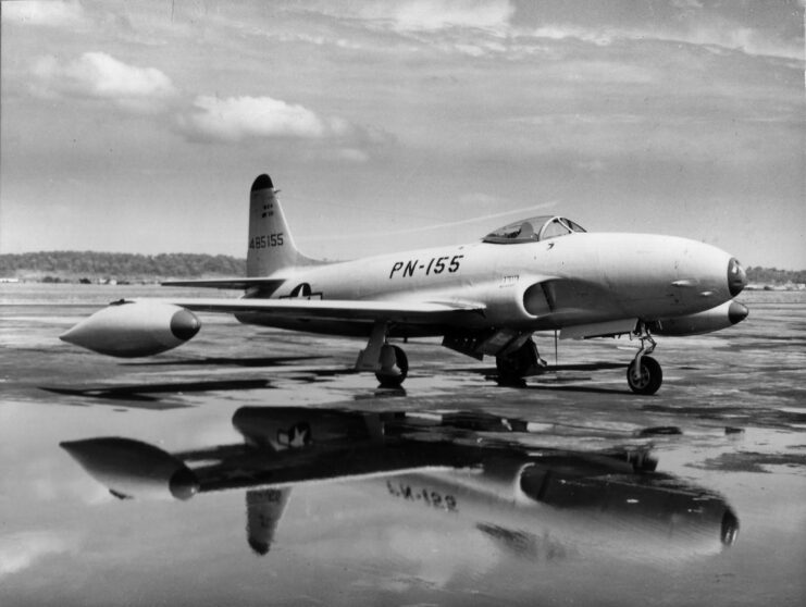 Lockheed P-80A Shooting Star parked on rain-soaked tarmac