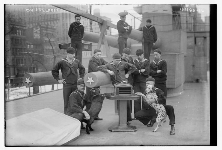 Sailors on the deck of the USS Recruit (1917) with a Dalmatian