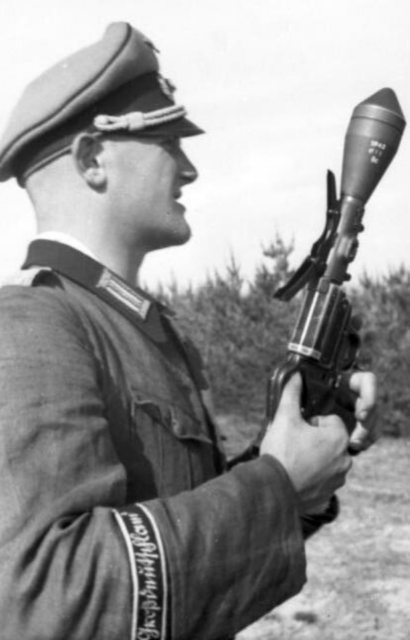 German soldier holding a Sturmpistole equipped with a Panzerwurfkörper 42