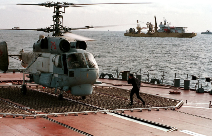 Helicopter taking off from the flight deck of Pyotr Velikiy