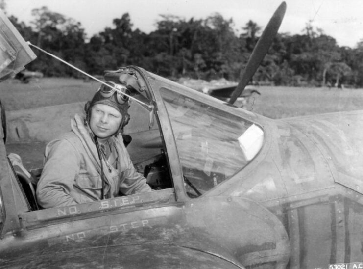 Richard Bong sitting in the cockpit of a Lockheed P-38 Lightning