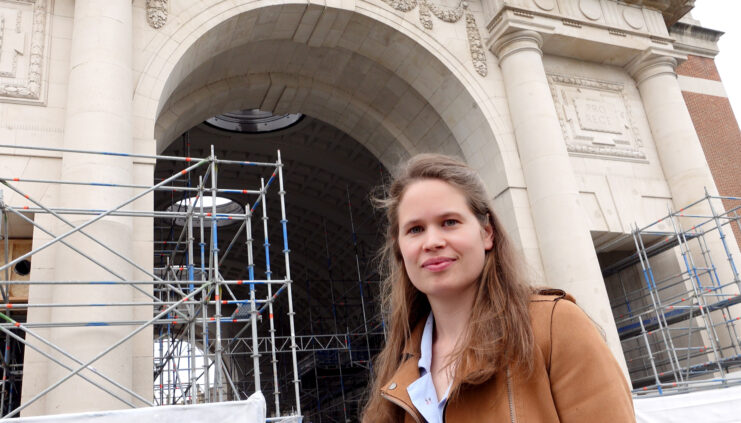 Sarah Camerlynck standing in front of the Menin Gate