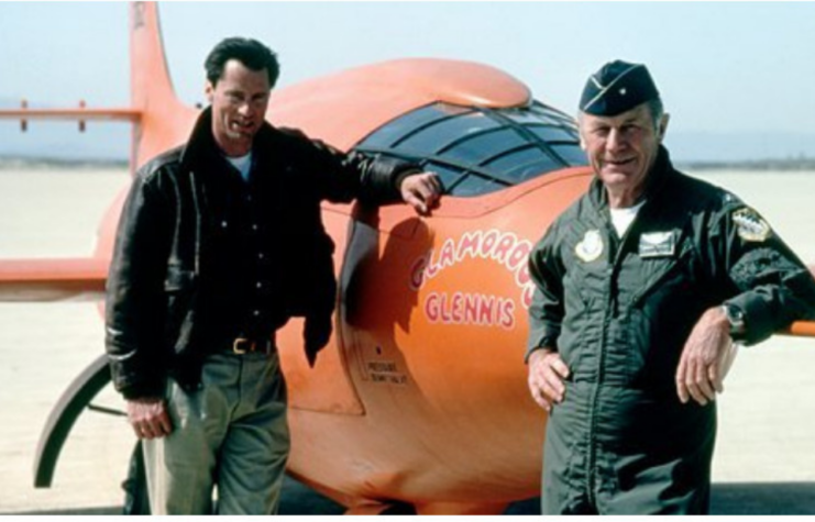 Sam Shepard and Chuck Yeager standing with a replica of the Bell X-1 'Glamorous Glennis'