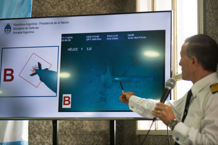 Man pointing to an underwater image of the ARA San Juan (S-42)