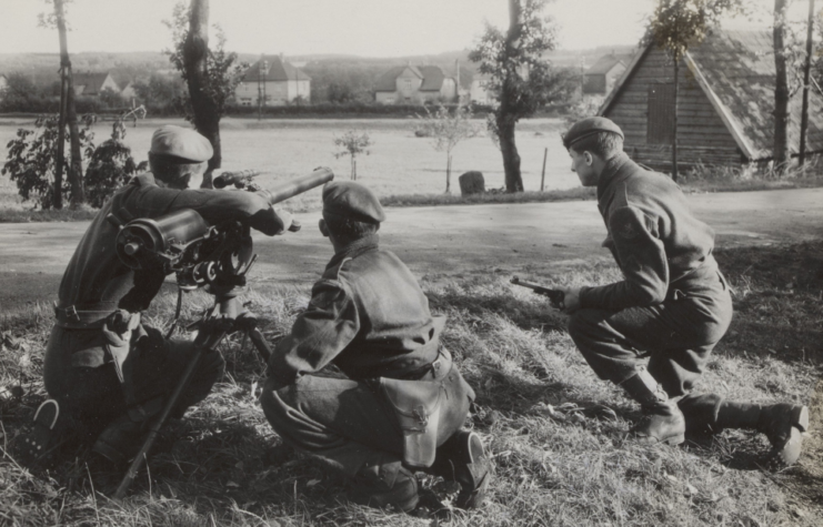 Three Dutch soldiers kneeling beside an M20 Recoilless Rifle