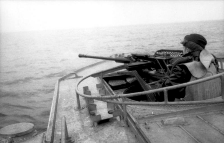 Kriegsmarine sailor manning an E-boat's bow gun at sea