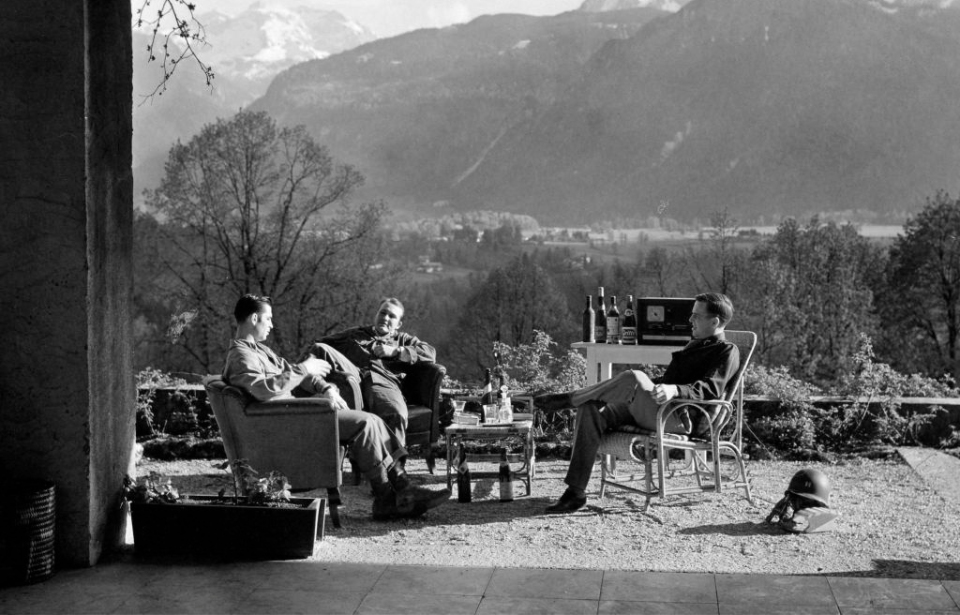 Three members of Easy Company sitting at the Eagle's Nest