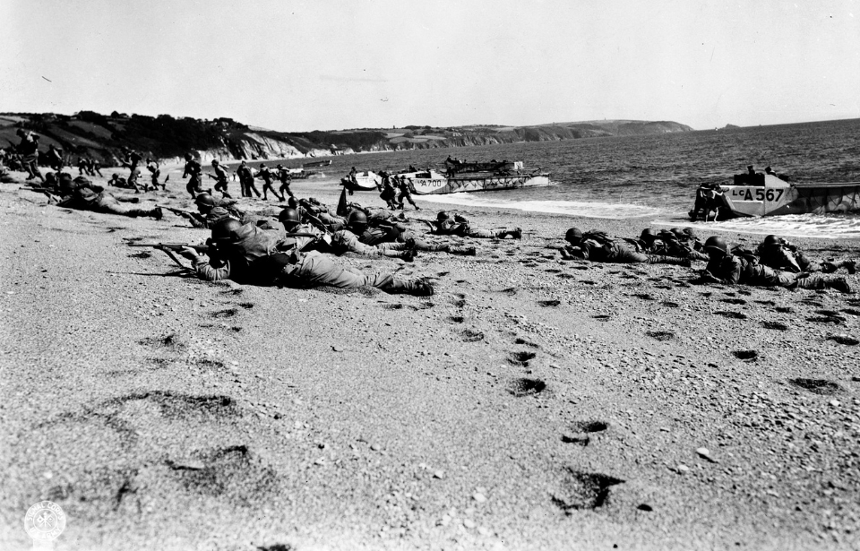 Allied troops crawling across the beach at Slapton Sands