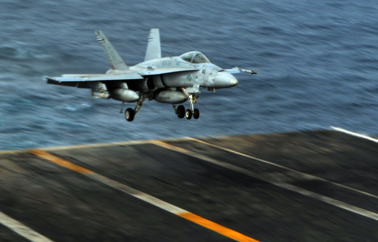 McDonnell Douglas F/A-18C Hornet landing aboard the USS Abraham Lincoln (CVN-72)