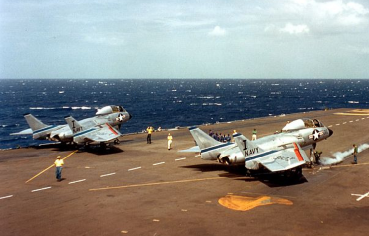 Two Vought F7U-3M Cutlasses on the flight deck of the USS Forrestal (CVA-59)