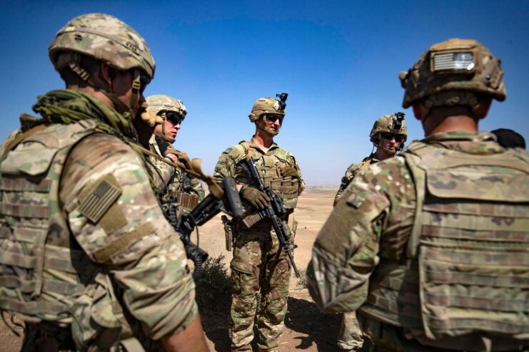 American soldiers standing together in the Syrian desert