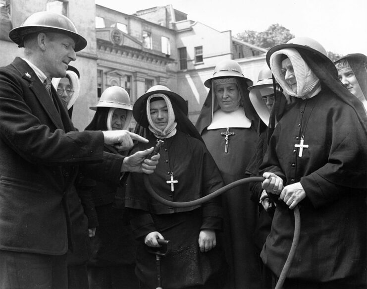 Group of nuns standing around an instructor