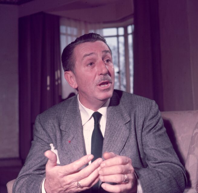 Walt Disney speaking while sat at a table