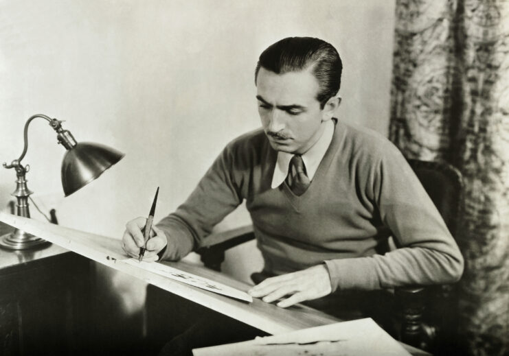 Walt Disney working at his drawing desk
