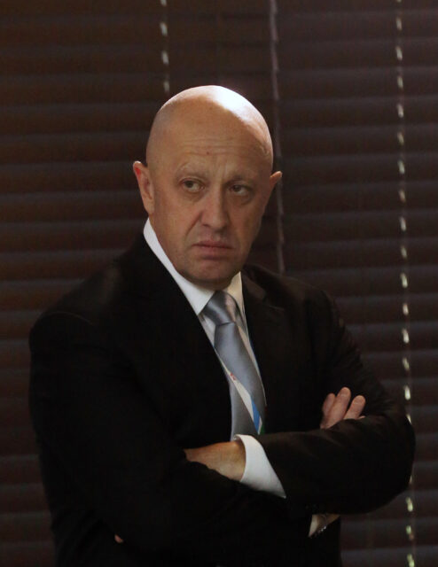 Yevgeny Prigozhin standing with his arms crossed