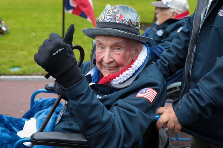 Jake Larson giving a thumbs up while sitting in a wheelchair