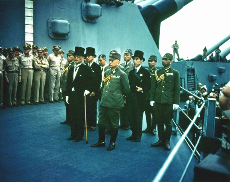 Japanese officials and US Navy personnel aboard the USS Missouri (BB-63)