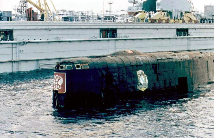 K1-141 Kursk's conning tower breaching the water's surface at port