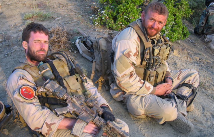 Michael Murphy and Matthew Axelson sitting together in uniform