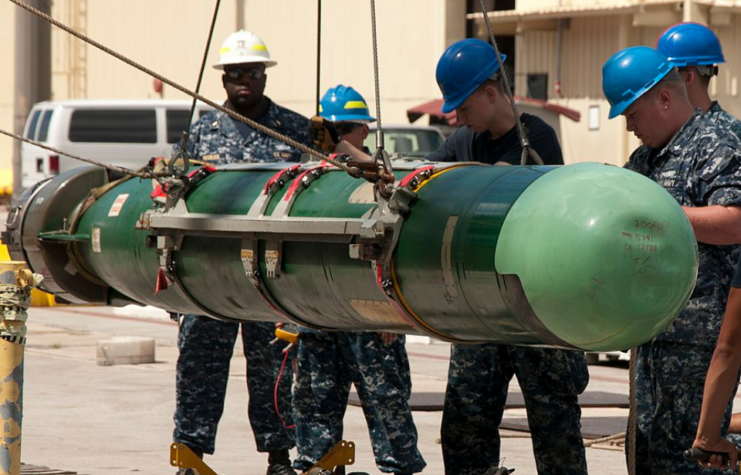 US Navy sailors standing around a Mk 48 ADCAP torpedo