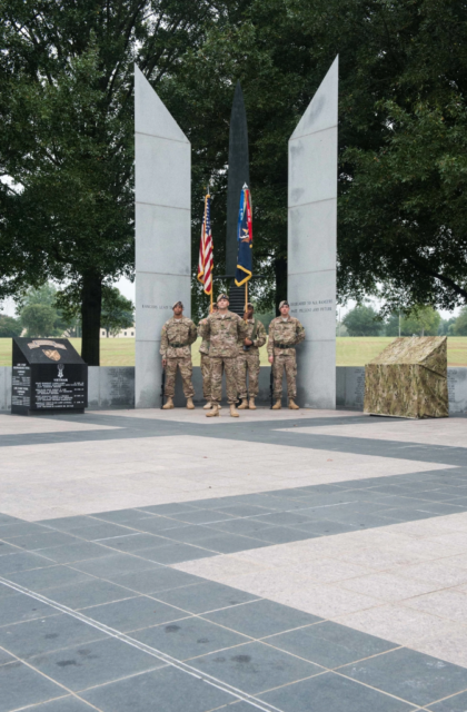 Five members of the 75th Ranger Regiment standing in front of the National Ranger Memorial