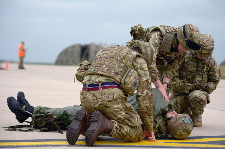 Four members of No. 617 Squadron RAF performing a training exercise