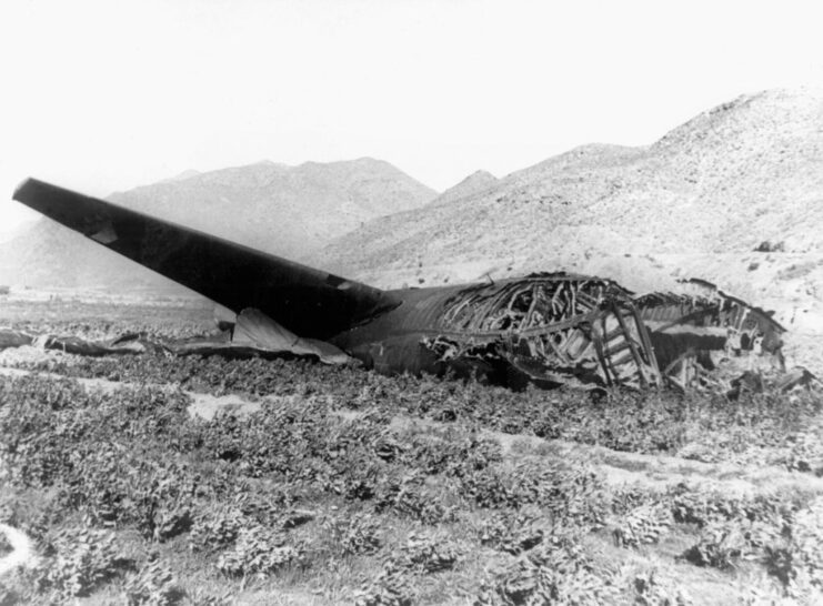Burned-out remains of a Boeing B-52G Stratofortress in a field