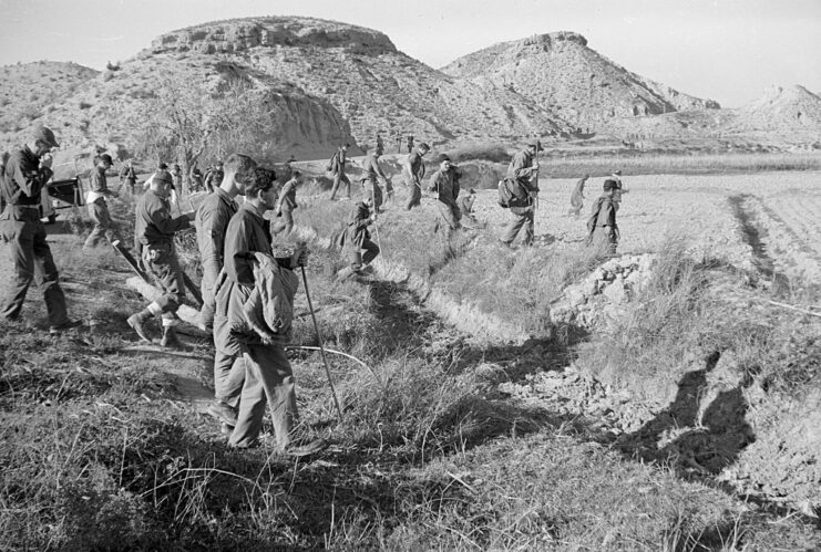 US airmen walking through a field