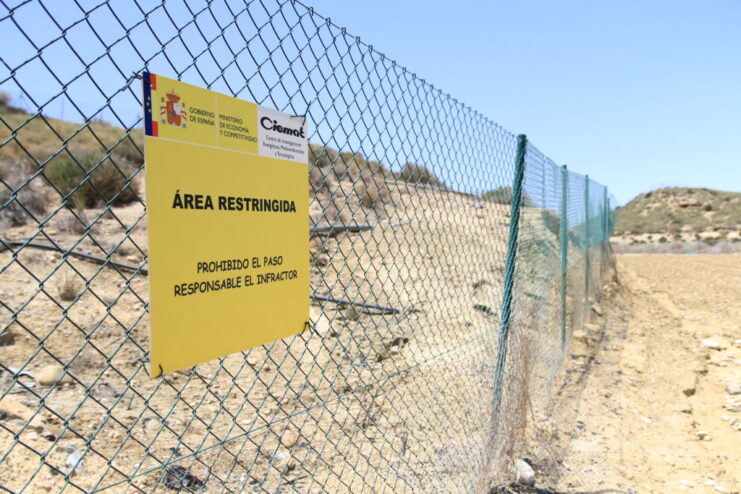 Chainlink fence with a sign warning that the area is restricted
