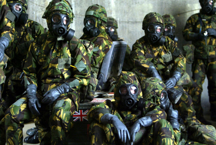 Royal Air Force (RAF) airmen dressed in protective gear and gas masks