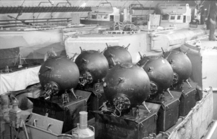 E-boats and sea mines packed away in a German naval bunker