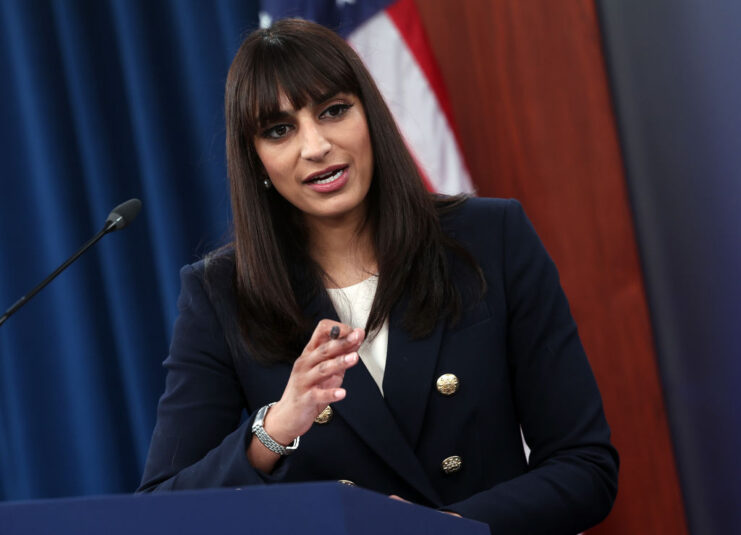 Sabrina Singh speaking at a podium
