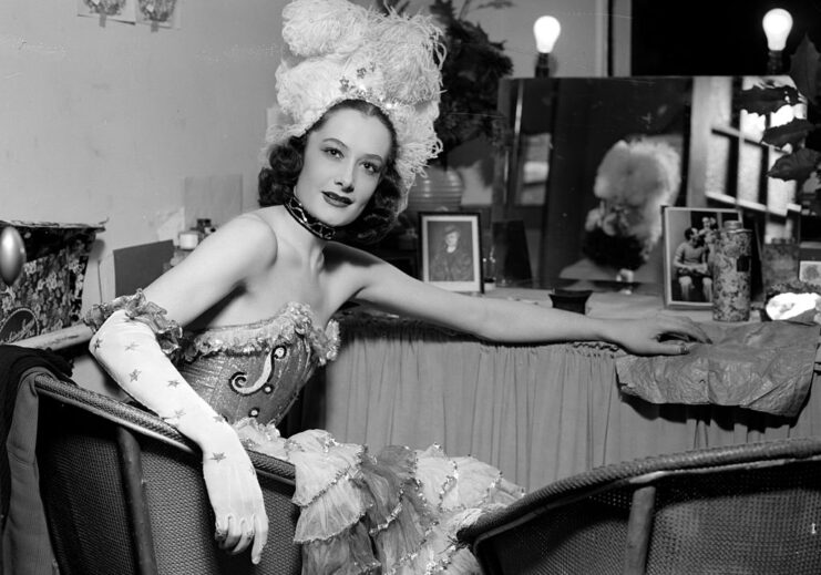 Windmill Girl sitting in full costume in her dressing room