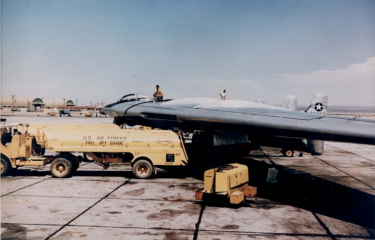 Refueling truck beneath a Northrop YB-49 on the runway